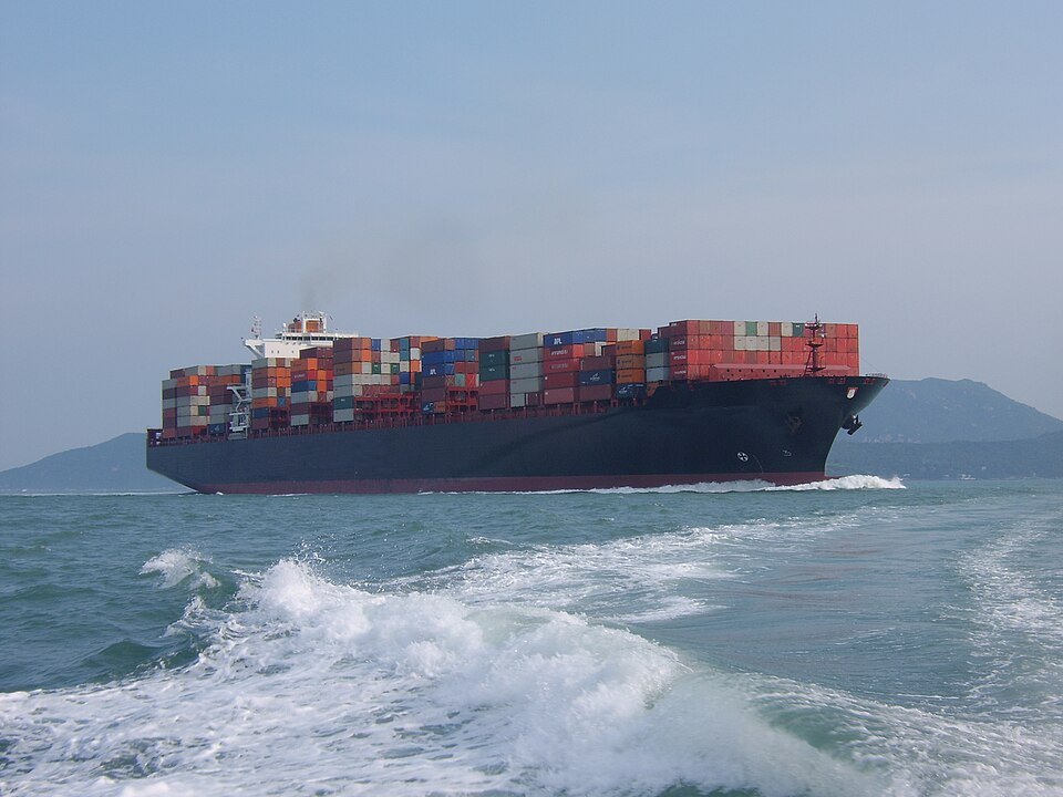 Container ship at sea under overcast skies