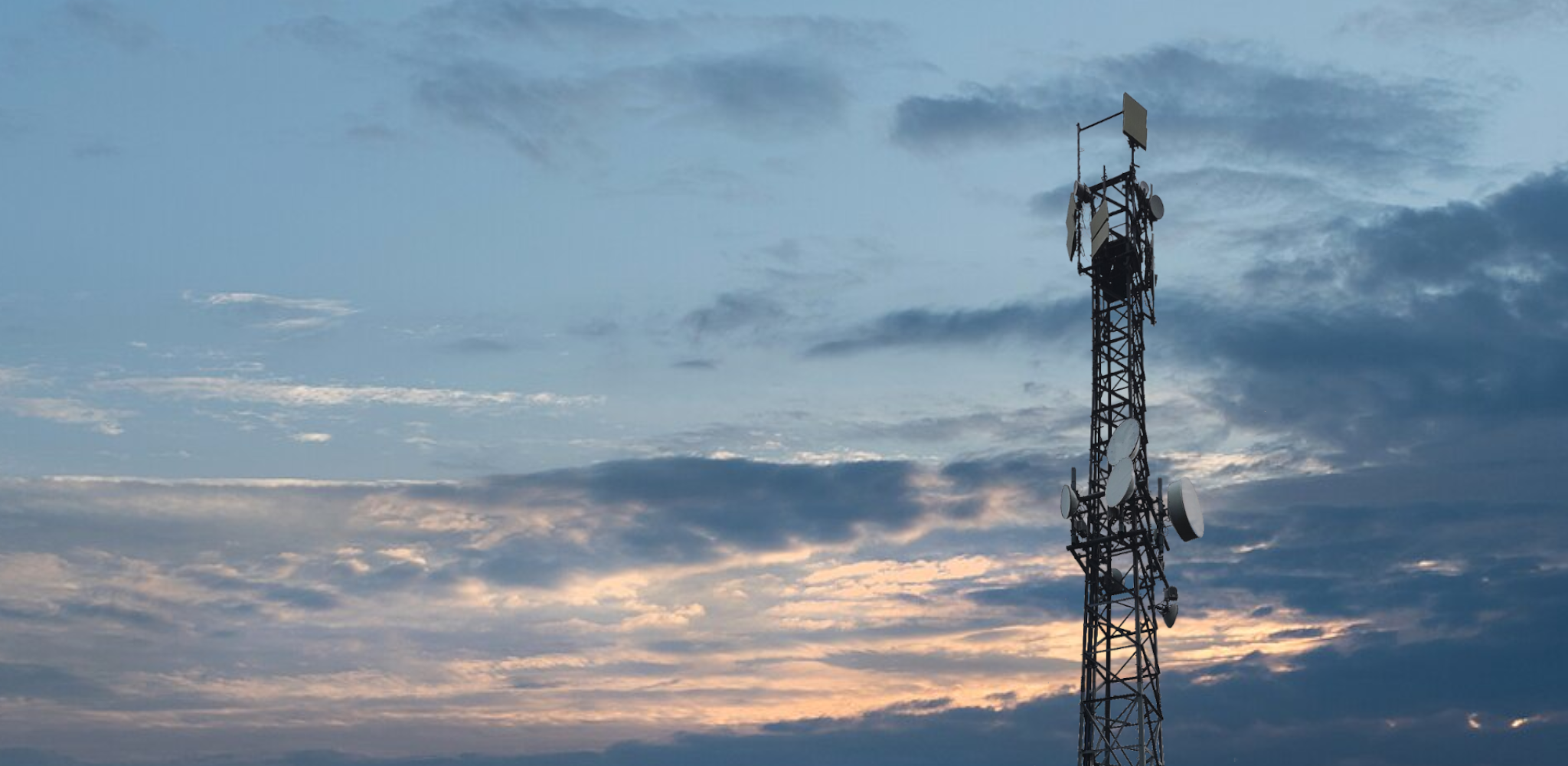 Antenna tower against a twilight sky